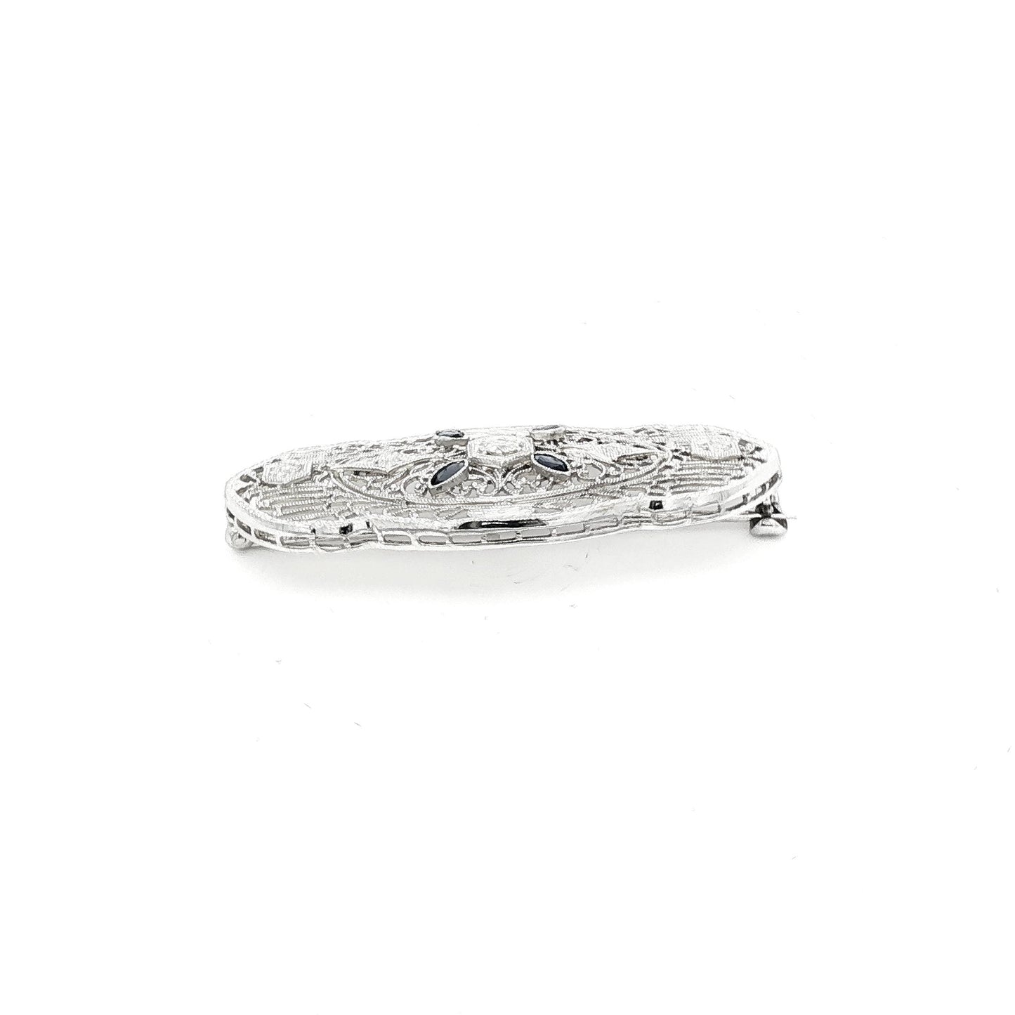 Depression filigree diamond and synthetic sapphire 14k white gold pin