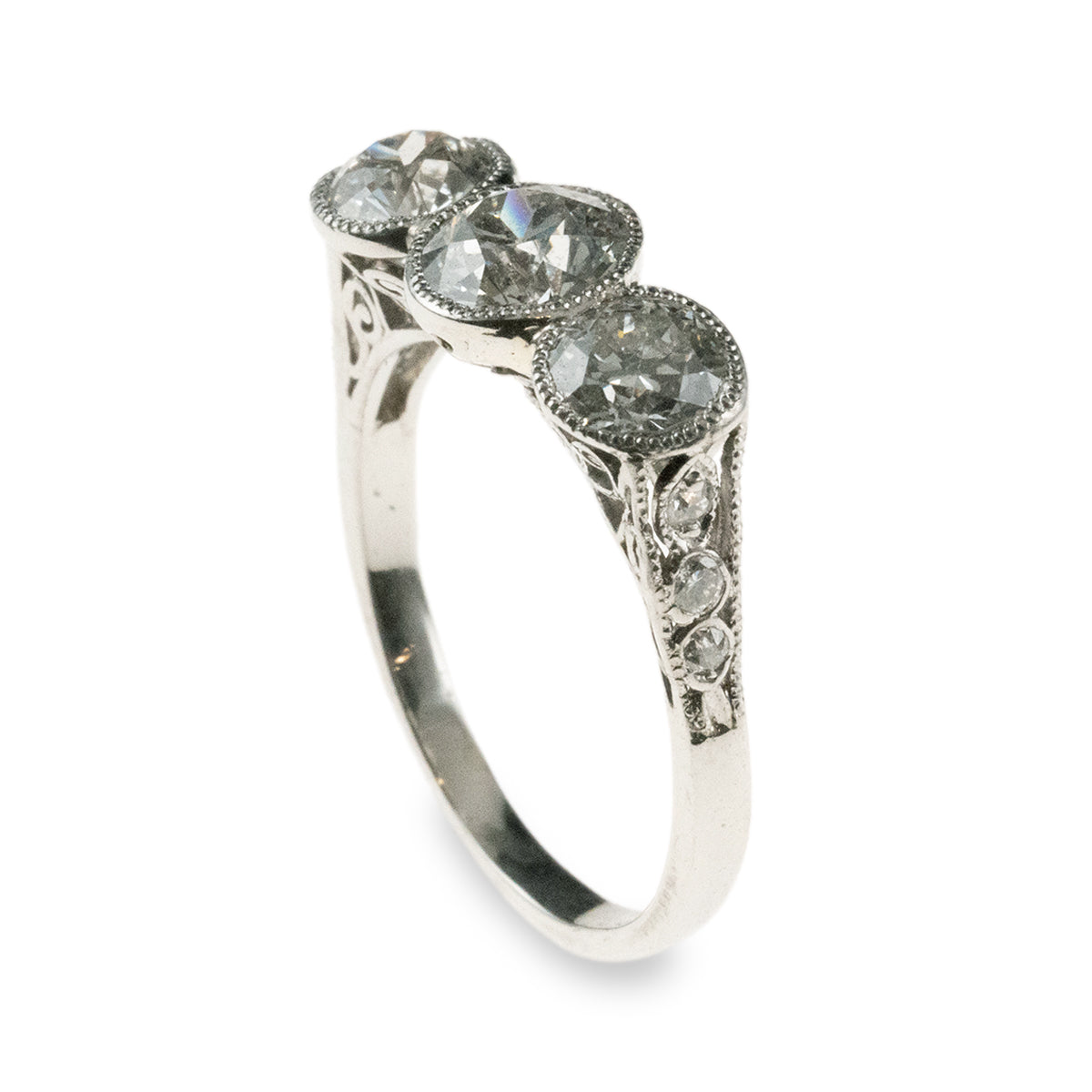 Antique 1920s-era platinum hand-fabricated filigree 3-diamond ring