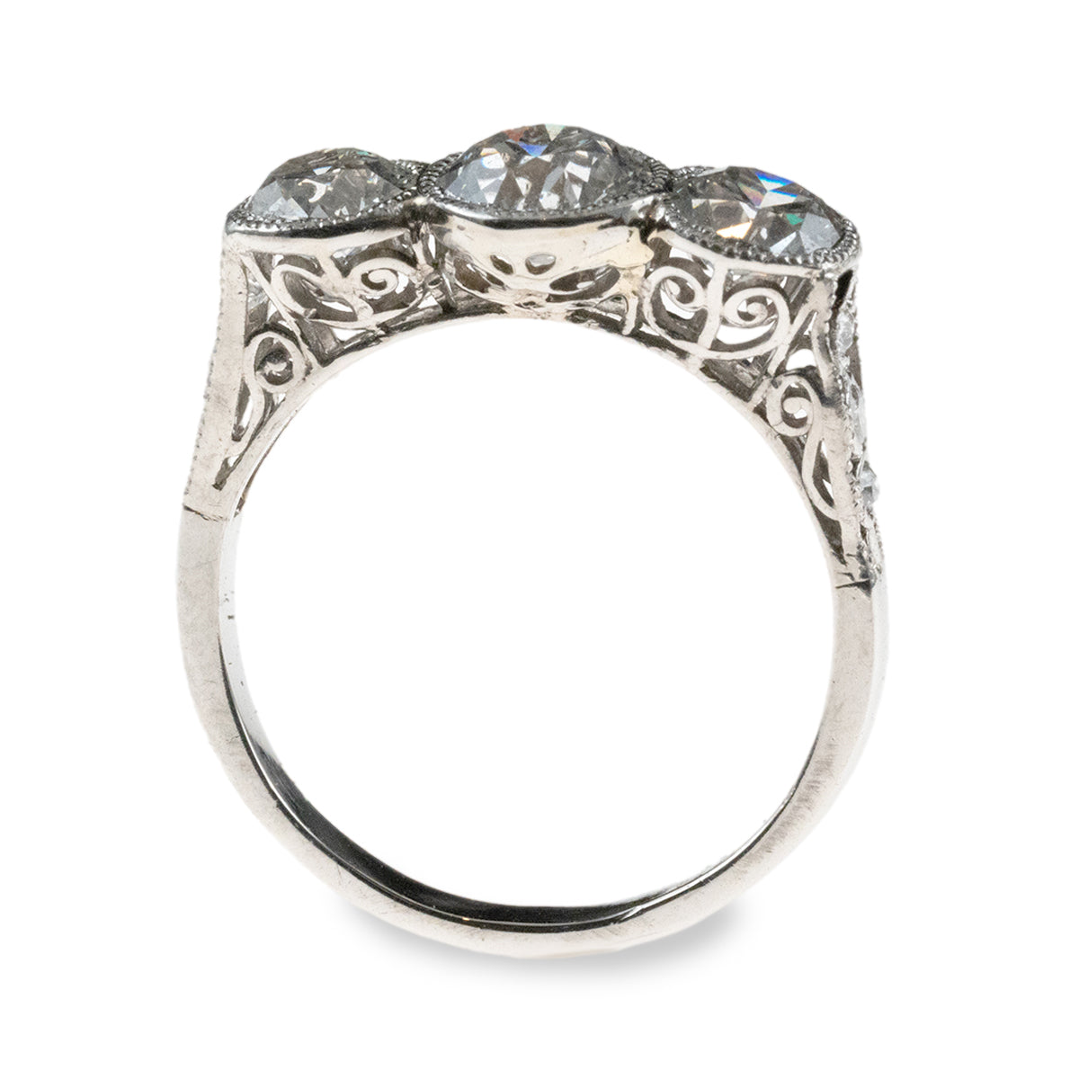 Antique 1920s-era platinum hand-fabricated filigree 3-diamond ring