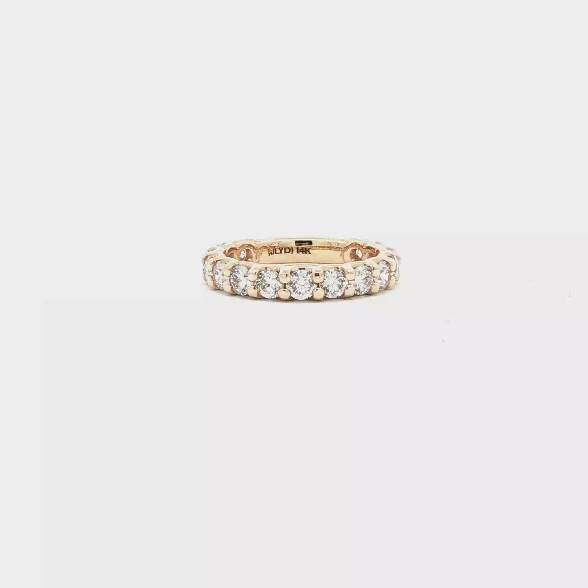 Shared prong diamond wedding ring