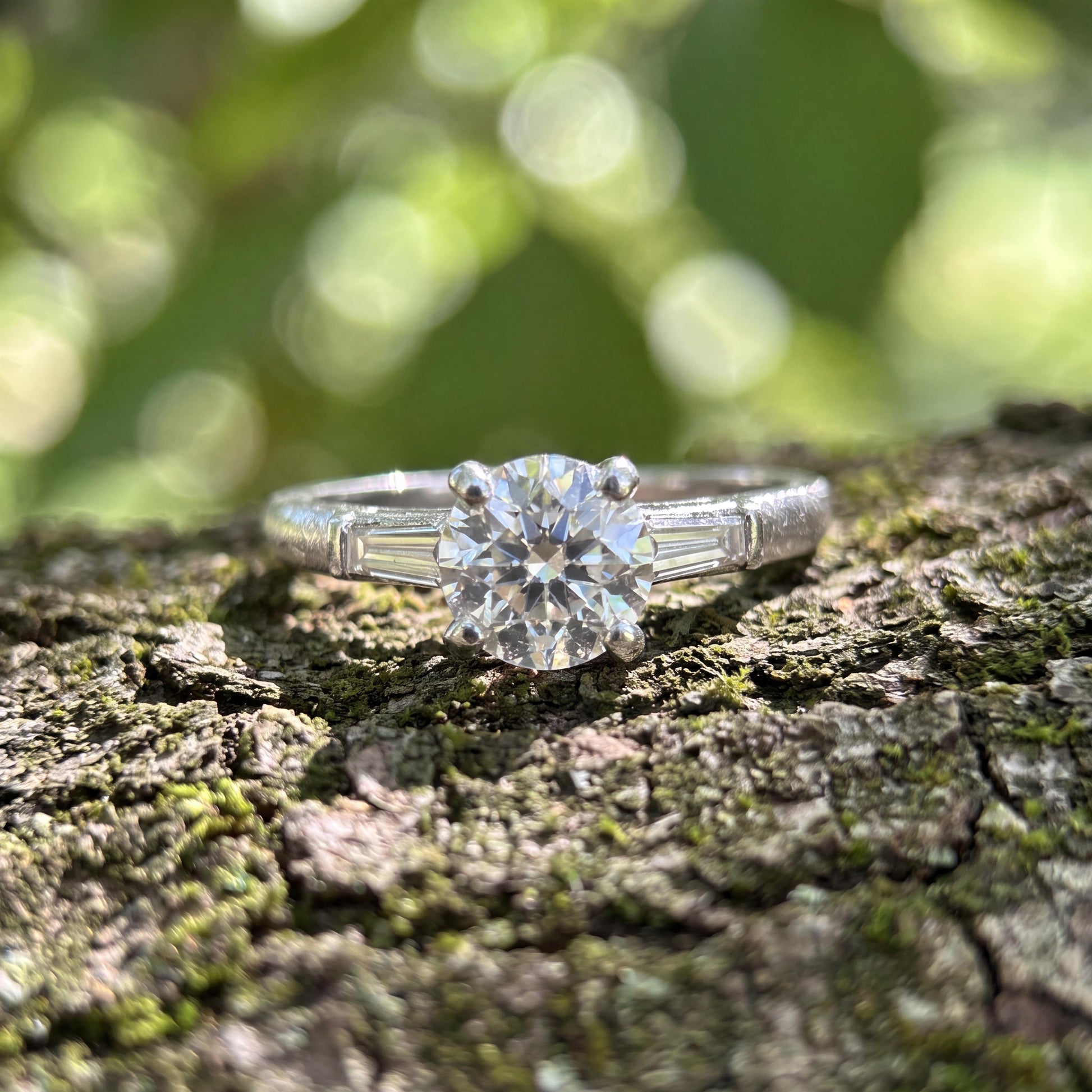 Mid-century Platinum .94 carat Old European Cut and Tapered Baguette Ring