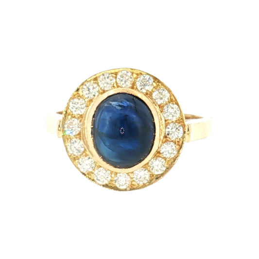 Late 20th-Century 18 Karat Yellow Gold Cabochon Blue Sapphire Halo Ring