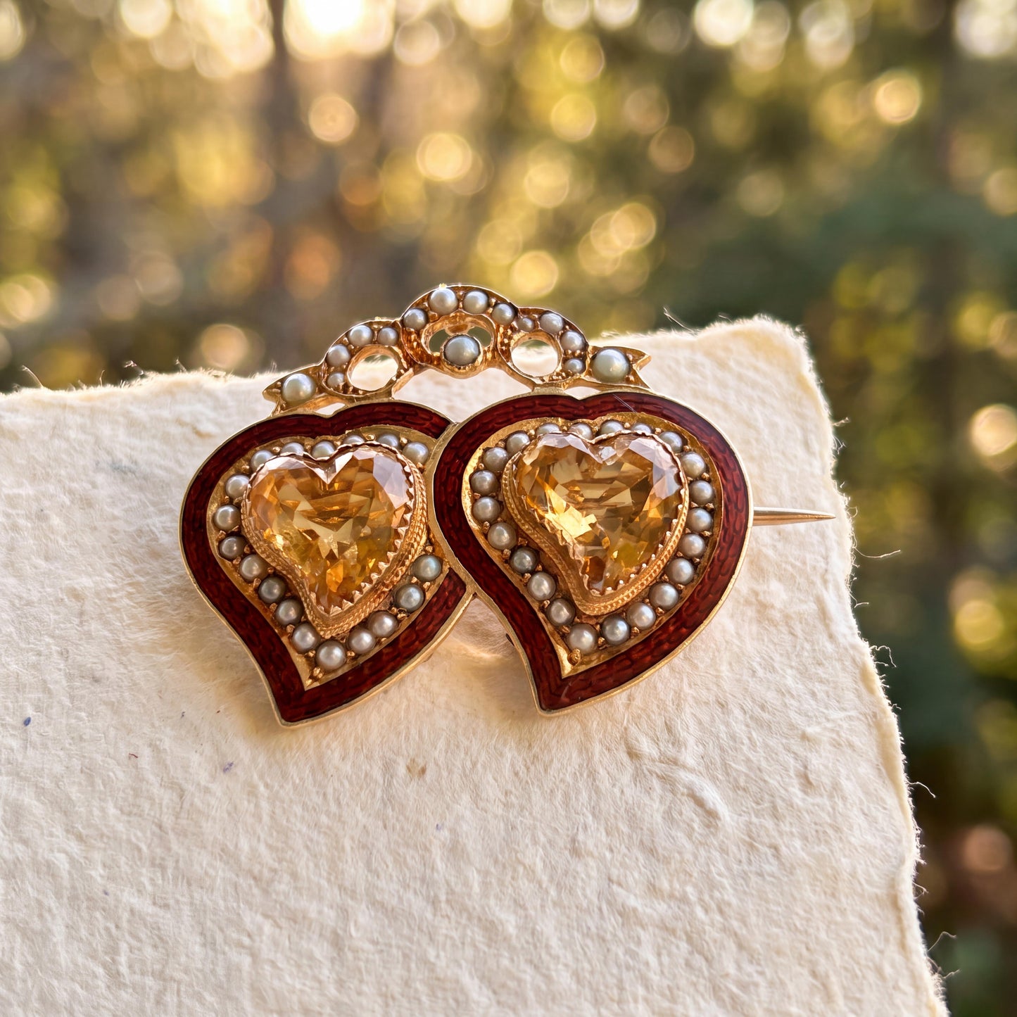 Late Victorian Basse-taille Enamel Topaz and Seed Pearl Double Heart Pin