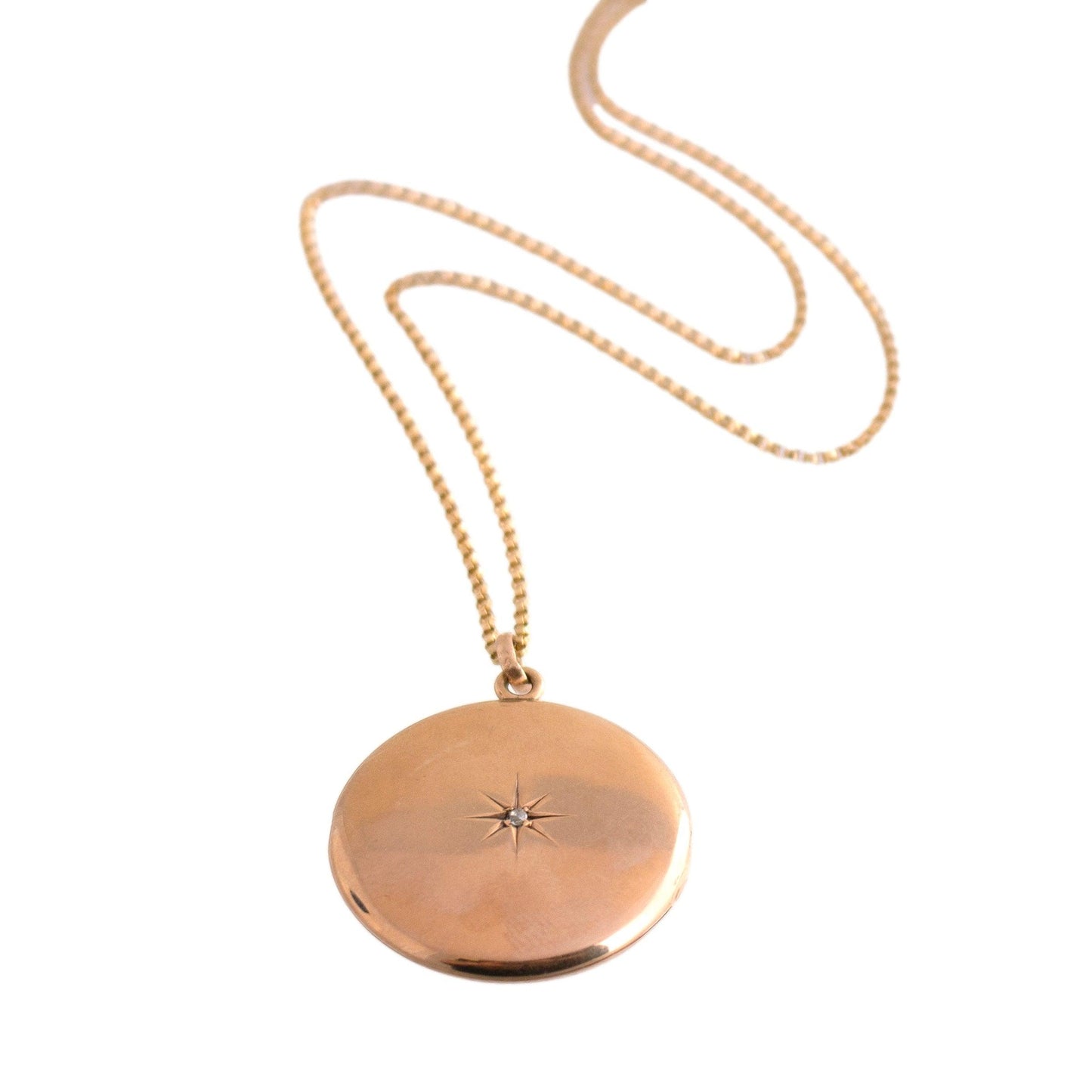Antique 14k yellow gold Round Locket Necklace with a Star Set Mine Cut Diamond