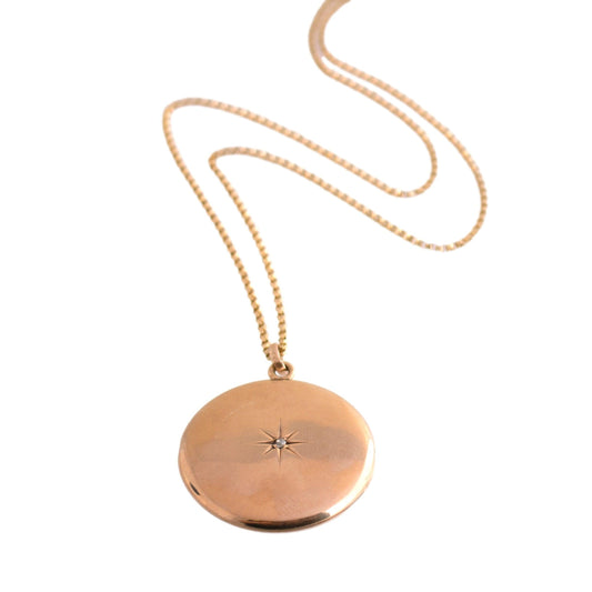 Antique 14k yellow gold Round Locket Necklace with a Star Set Mine Cut Diamond
