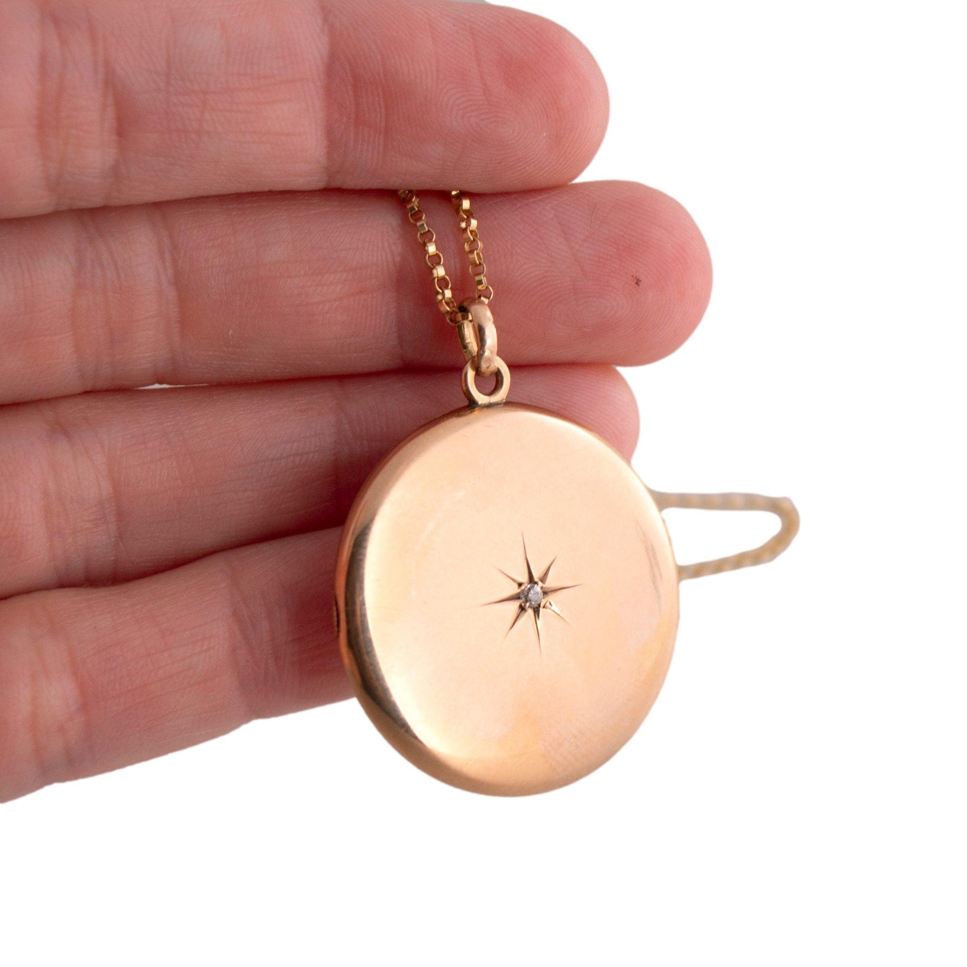 Antique 14k yellow gold Round Locket Necklace with a Star Set Mine Cut Diamond
