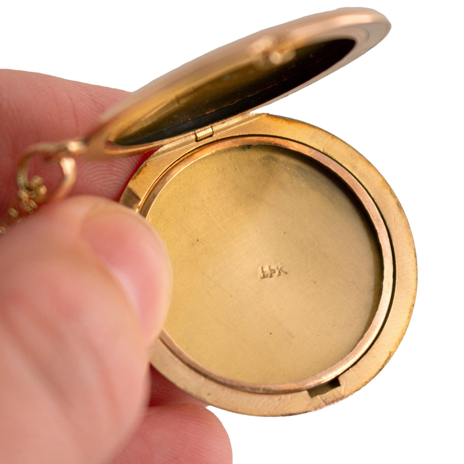 Antique 14k yellow gold Round Locket Necklace with a Star Set Mine Cut Diamond