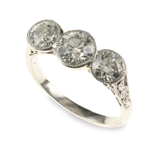 Antique 1920s-era platinum hand-fabricated filigree 3-diamond ring