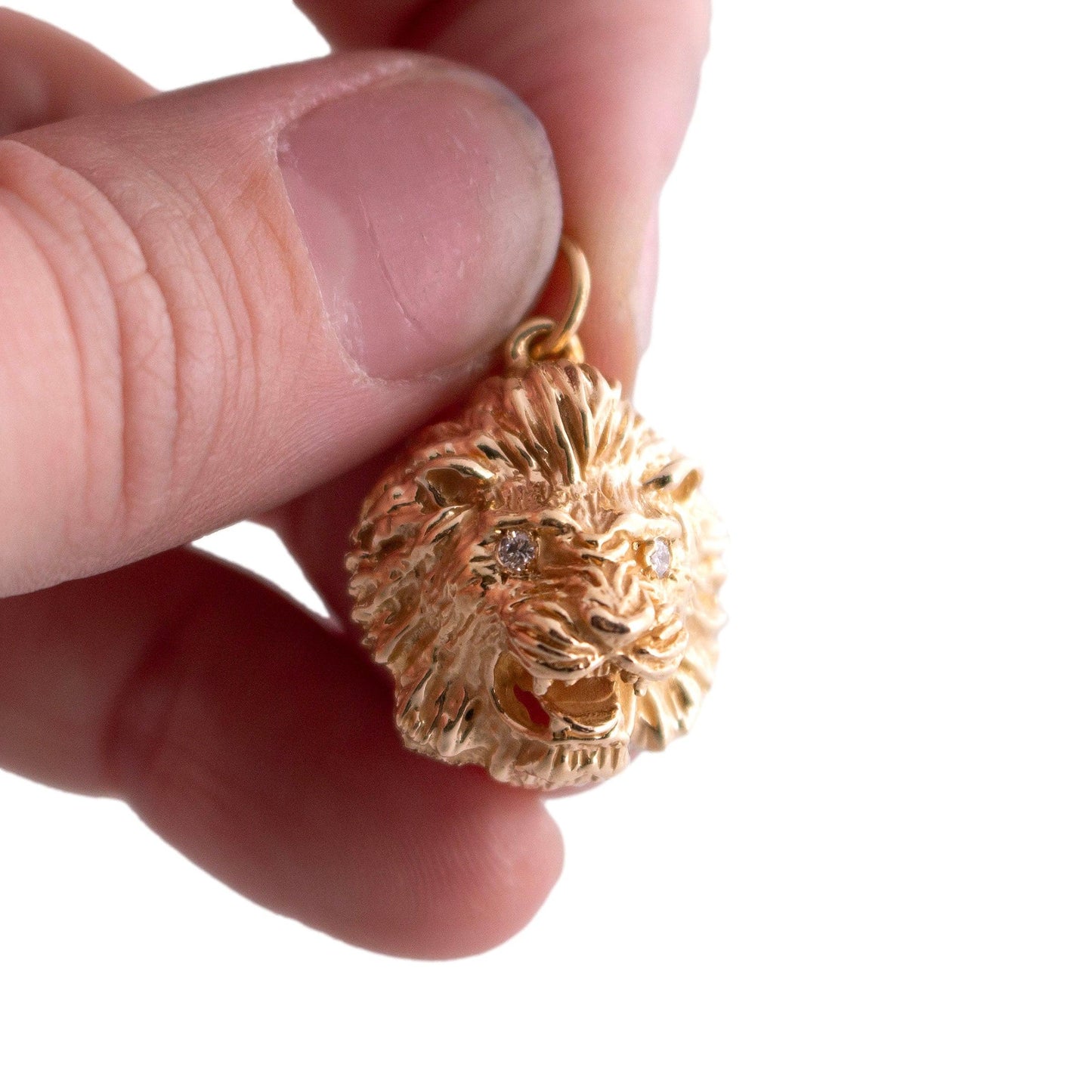 14k yellow gold cast Lion Head Charm with Diamond Eyes