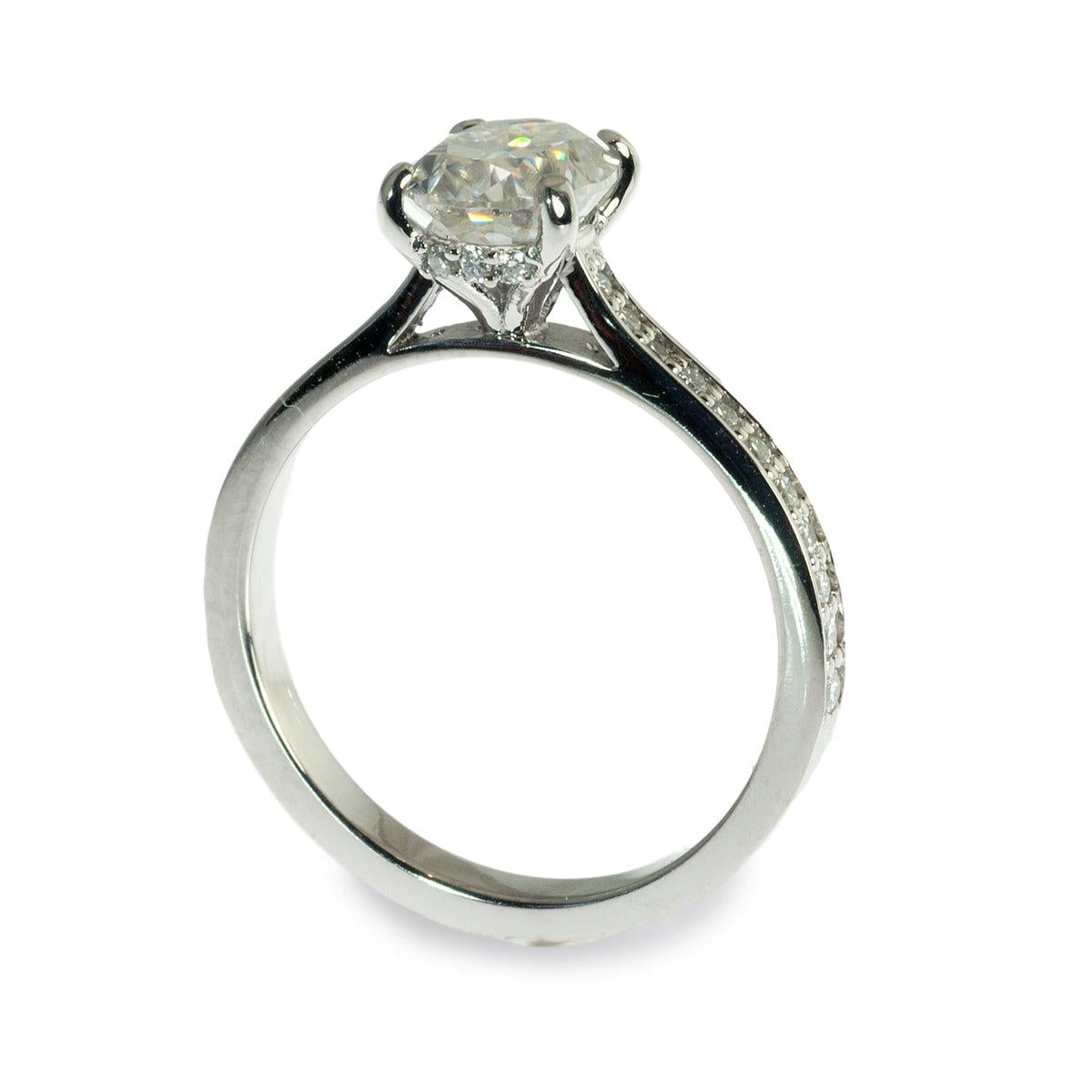 Oval center hidden halo engagement ring