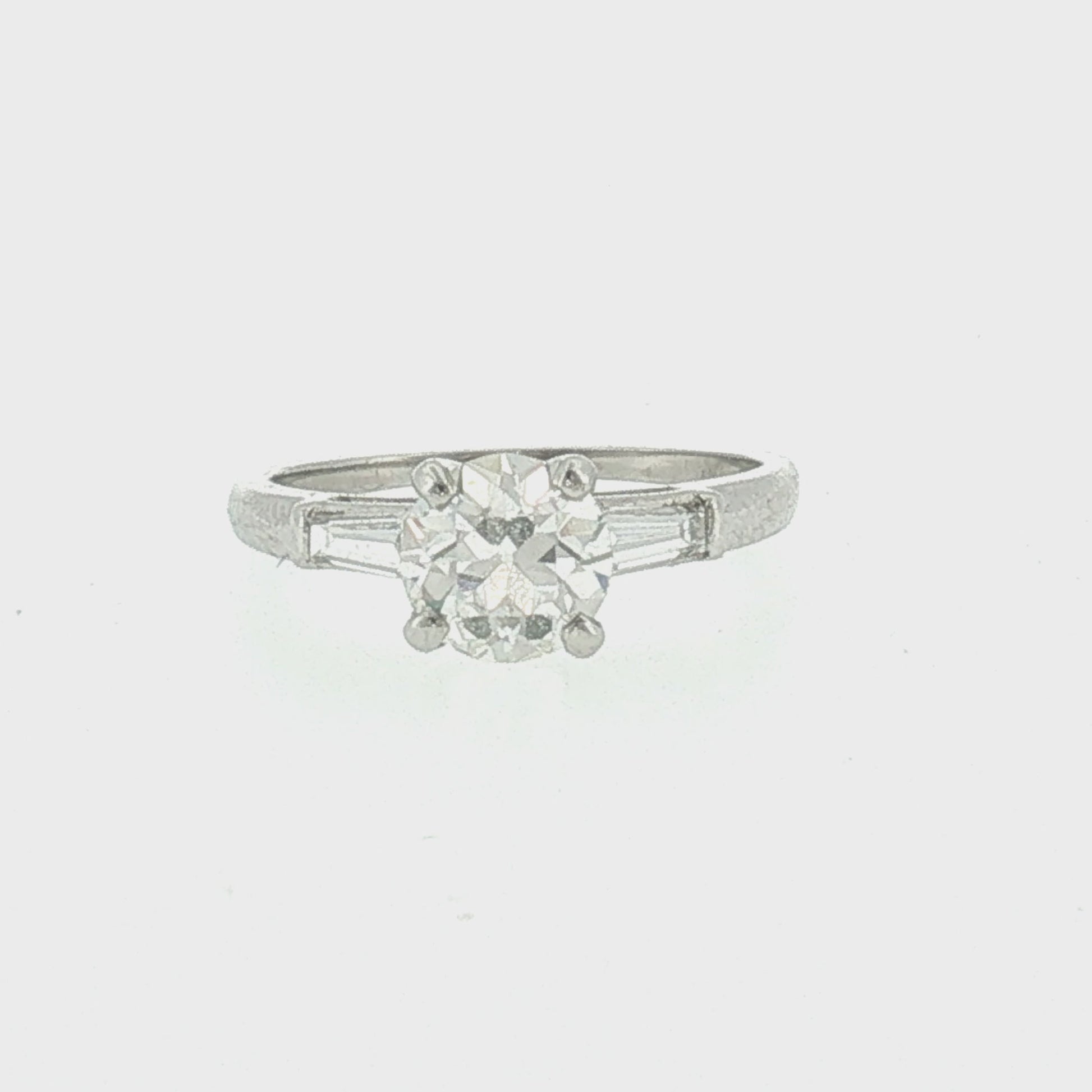 Mid-century Platinum .94 carat Old European Cut and Tapered Baguette Ring