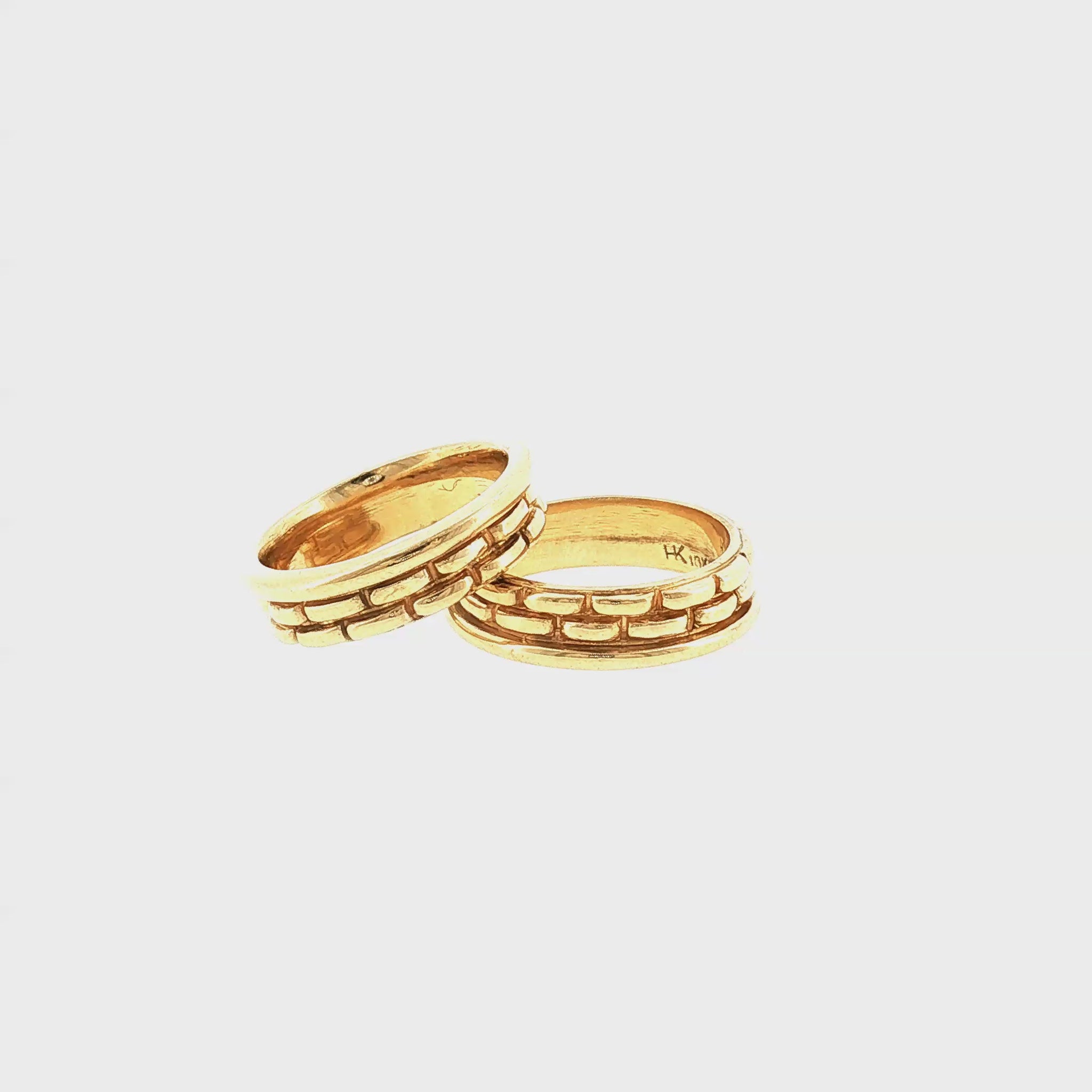 A Pair of Late 20th-Century 18k Yellow Gold Basket Weave Style Guard Rings