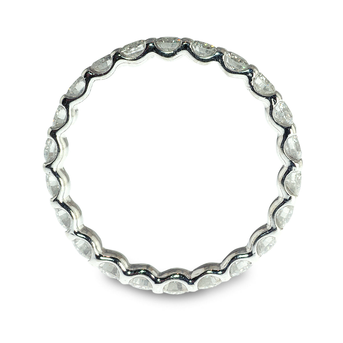 Shared prong diamond eternity ring