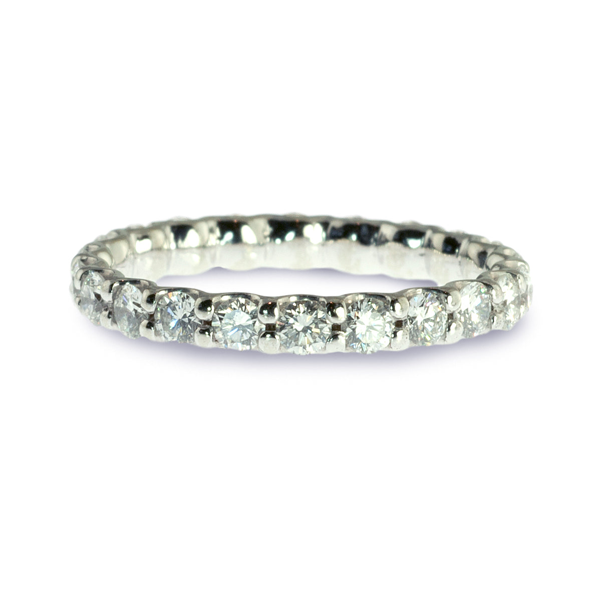 Shared prong diamond eternity ring